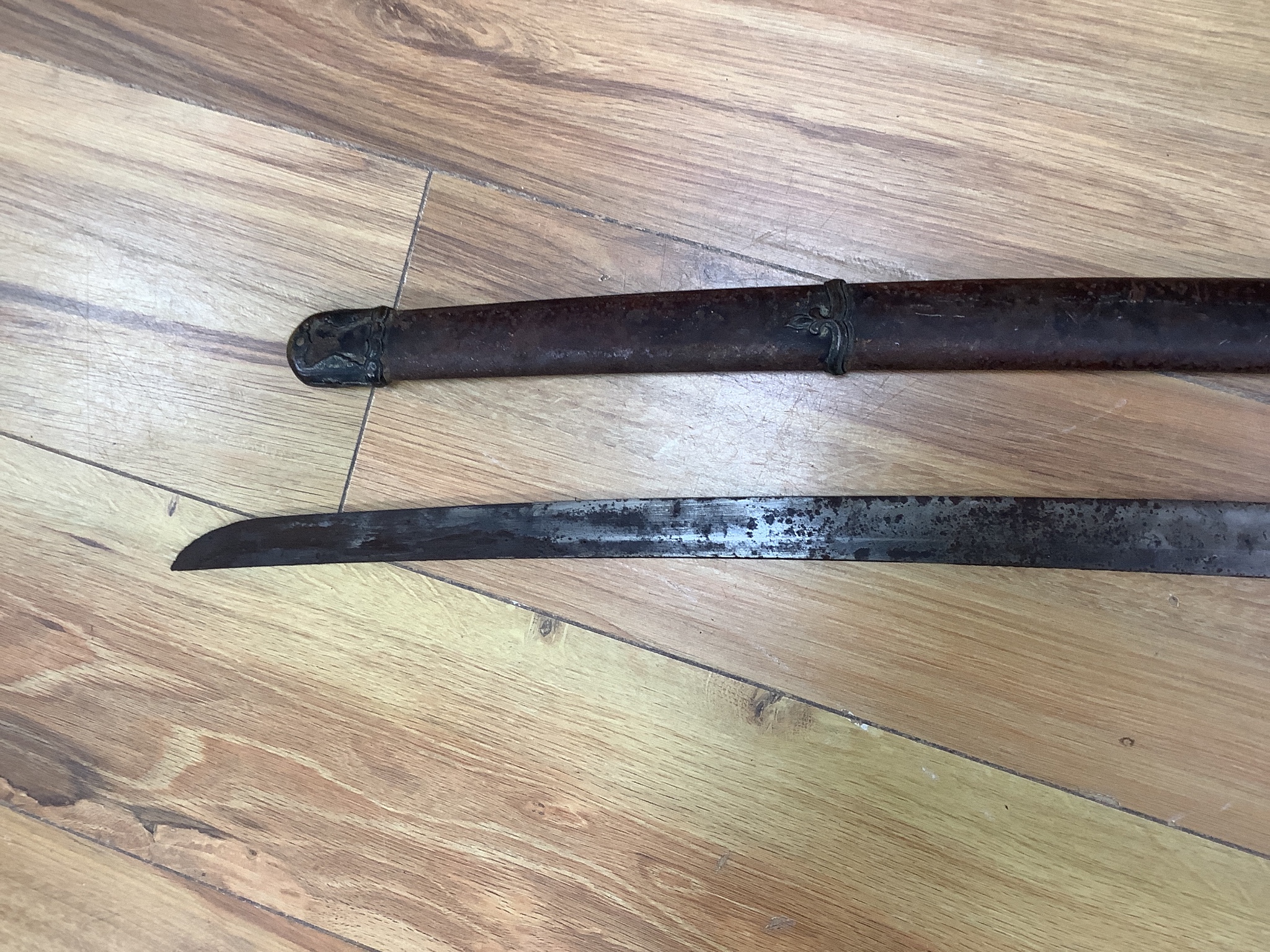 A Japanese Type 94 military sword lacking tsuba and hilt. Signed tang. 90cm excl scabbard